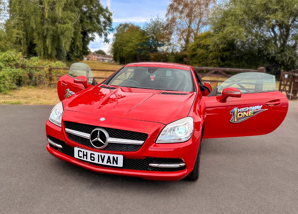 Front of red Mercedes-Benz SLK 250 with doors open